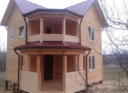 Дом из бруса с балконом и террасой